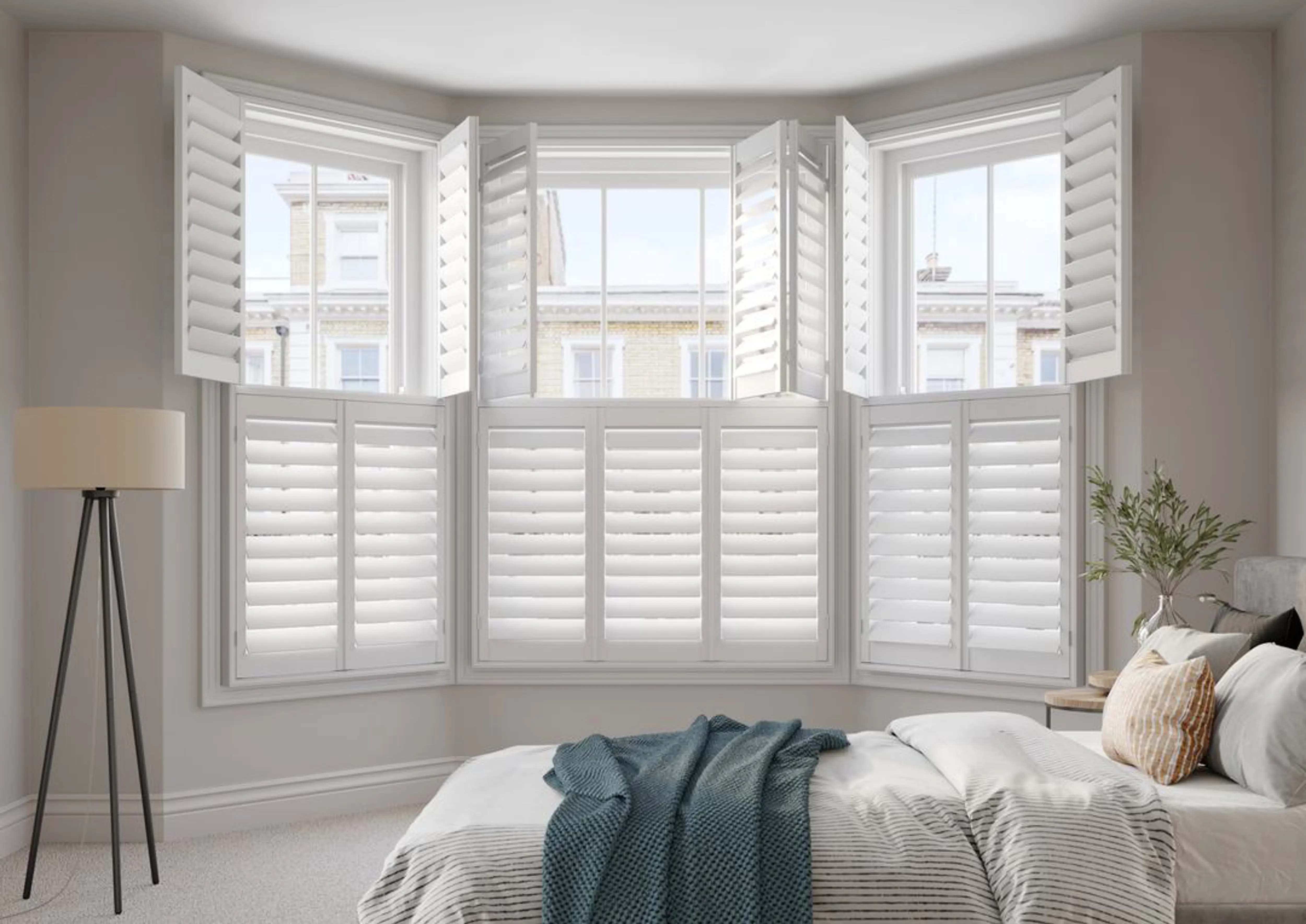 Vivid White bay window wooden shutters in neutral bedroom