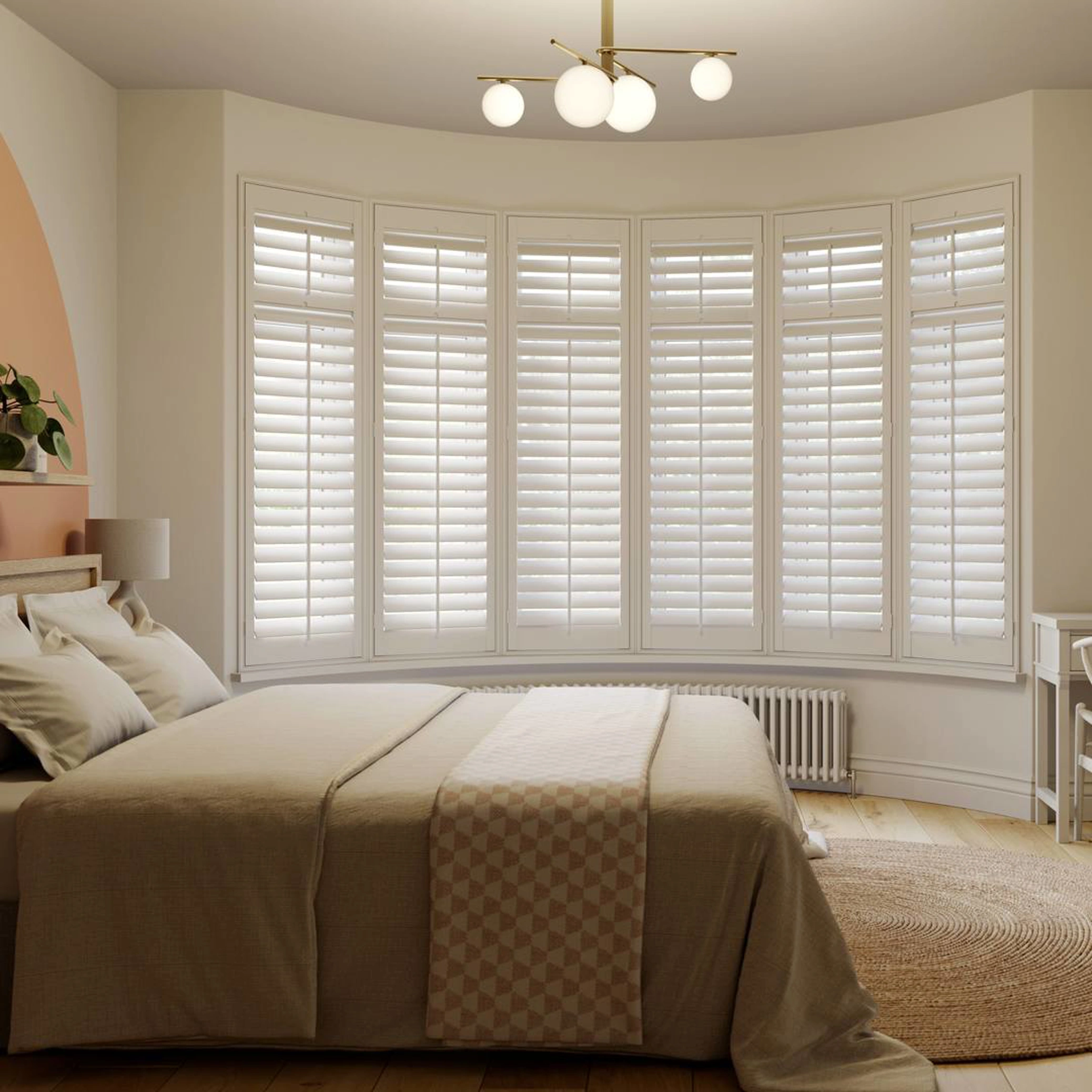 Vivid White wooden shutters in a curved bay and neutral bedroom