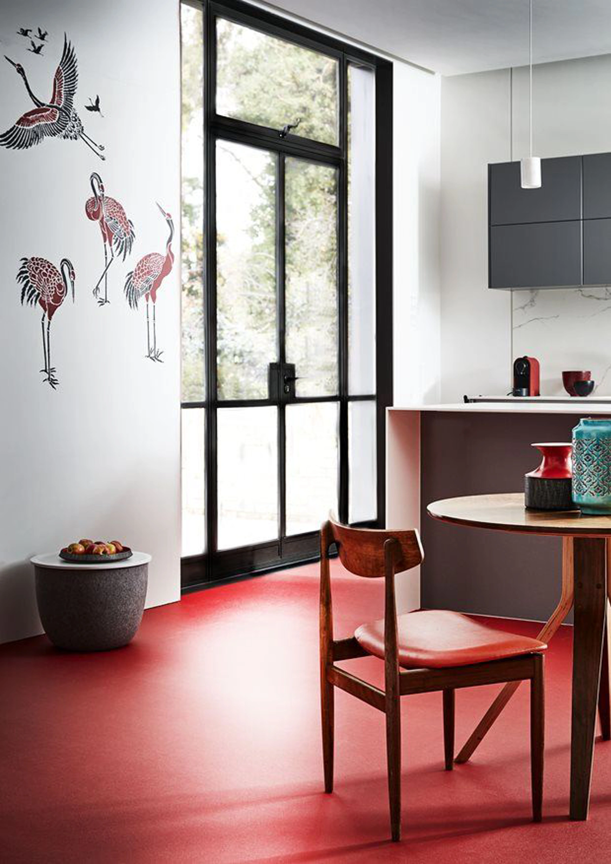 Modern kitchen with red flooring 