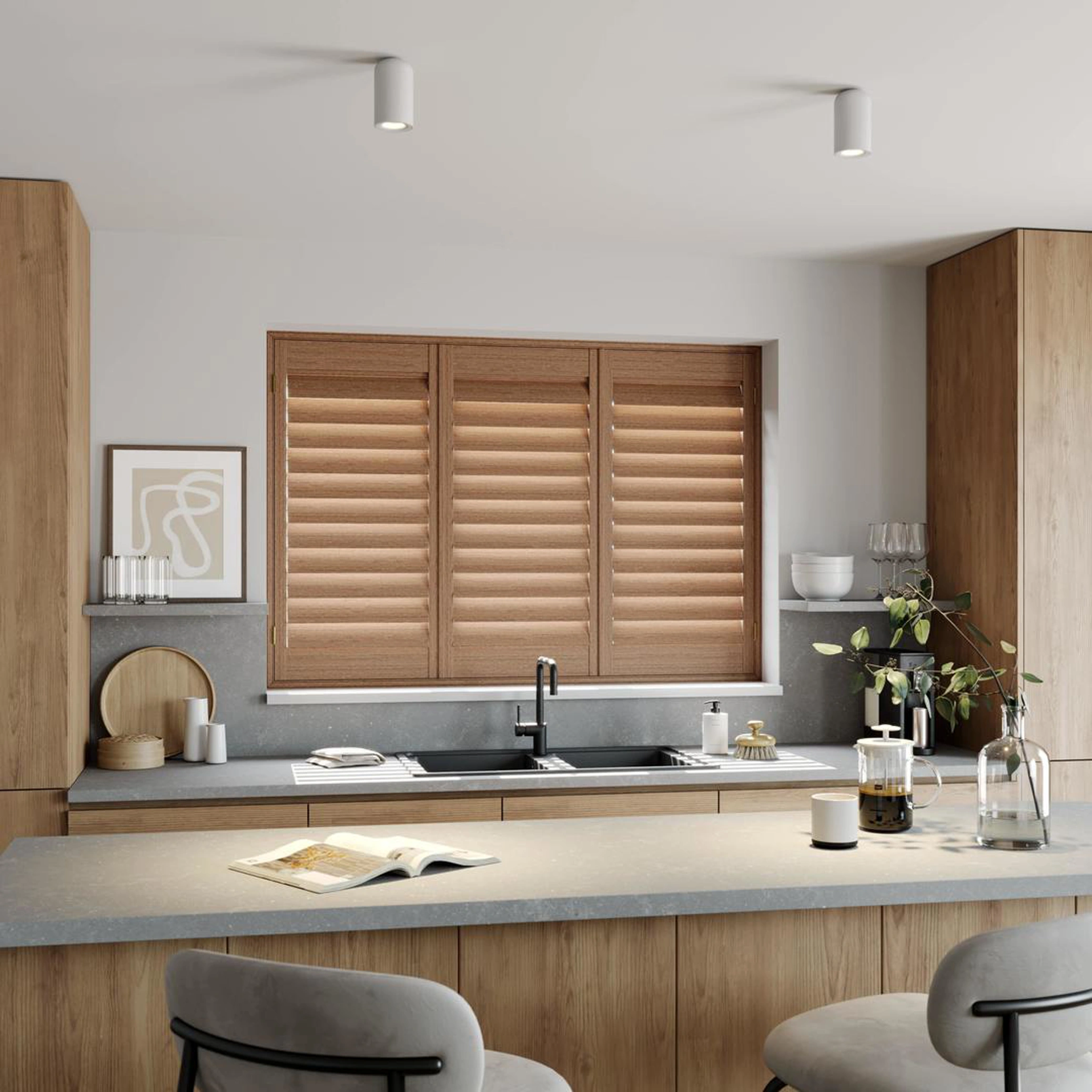 A modern kitchen with Honey Stained full height wooden shutters 