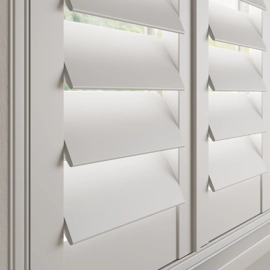 A Snow White faux wood shutter with 89mm slats and a hidden tilt rod