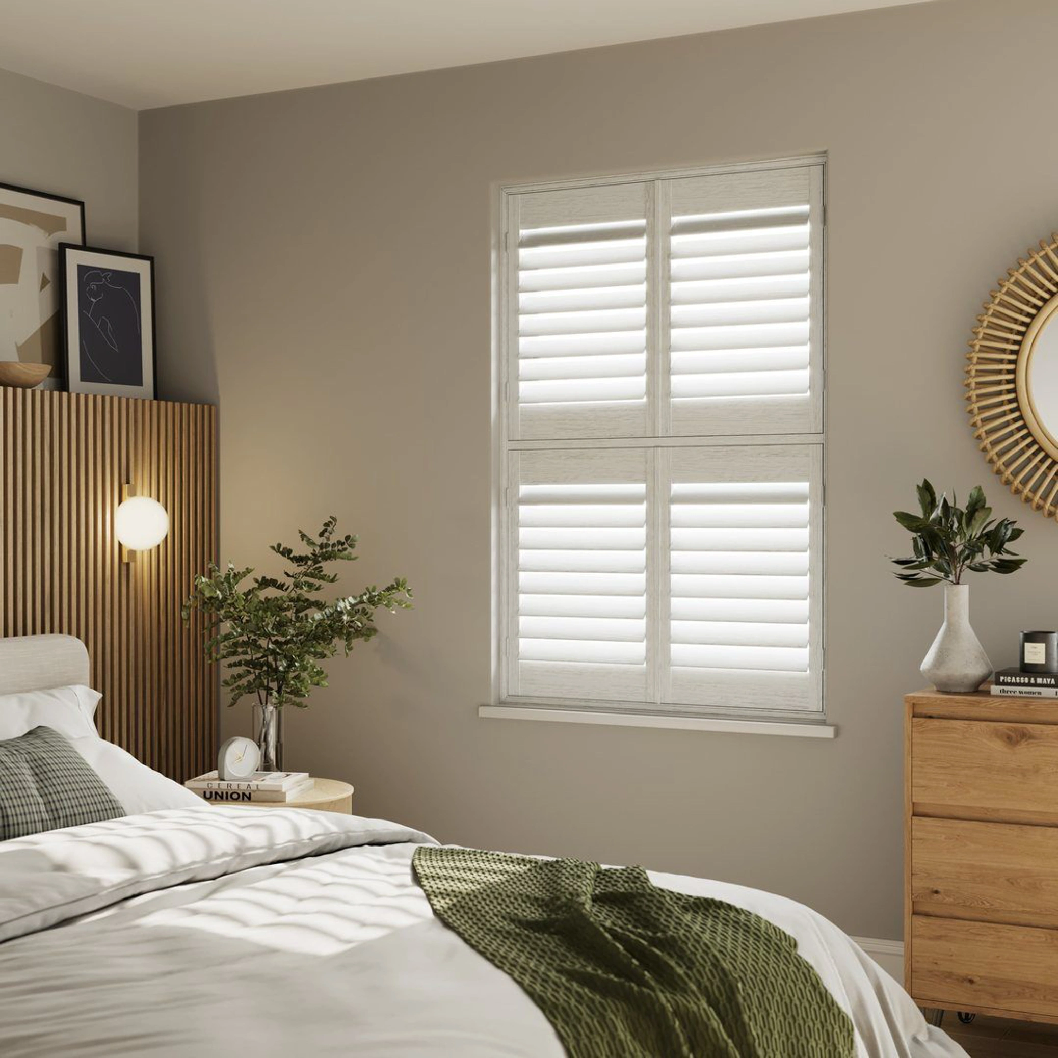 A neutral decorated bedroom with White Grained tier on tier wooden shutters 