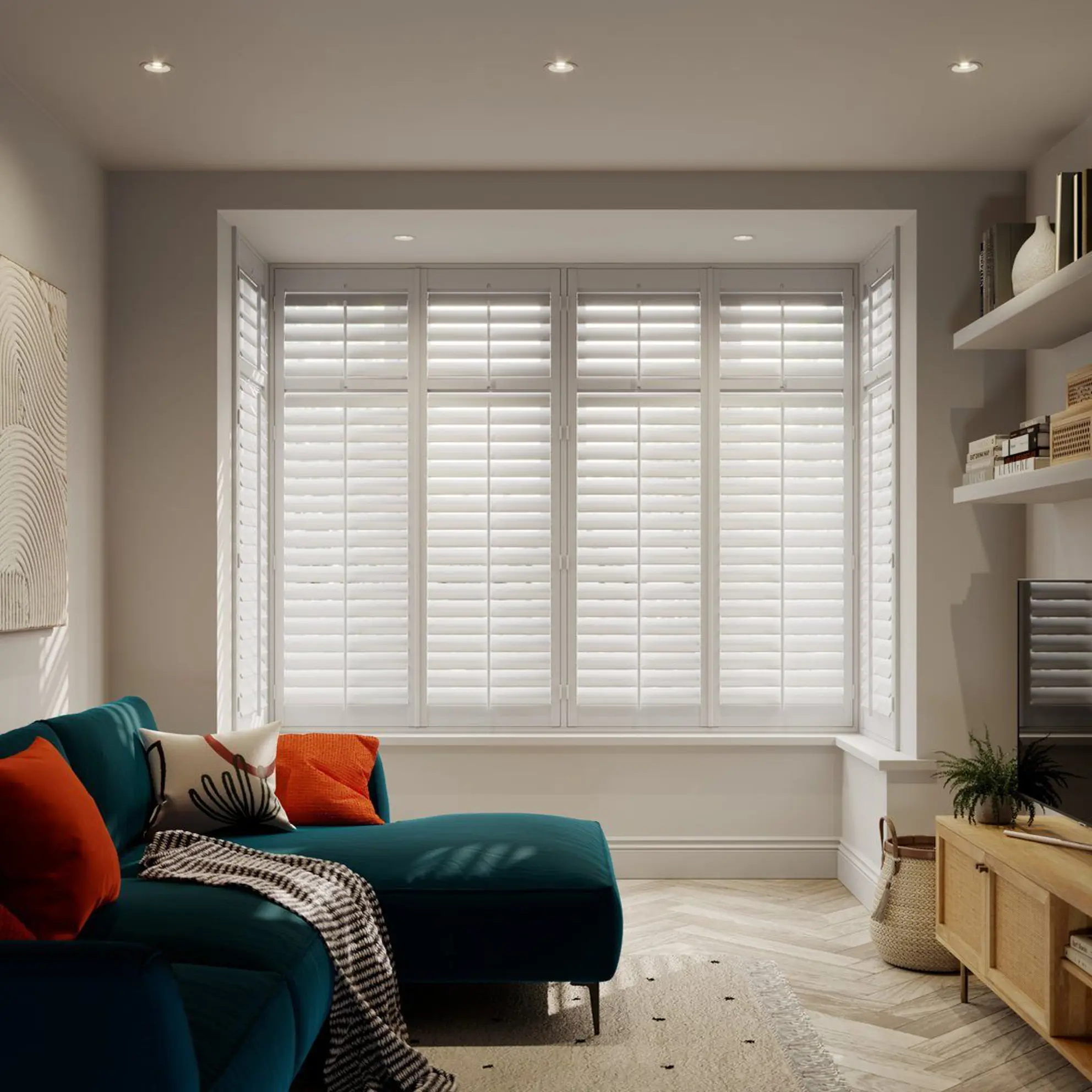 Vivid White wooden shutters in box bay in living room with blue sofa