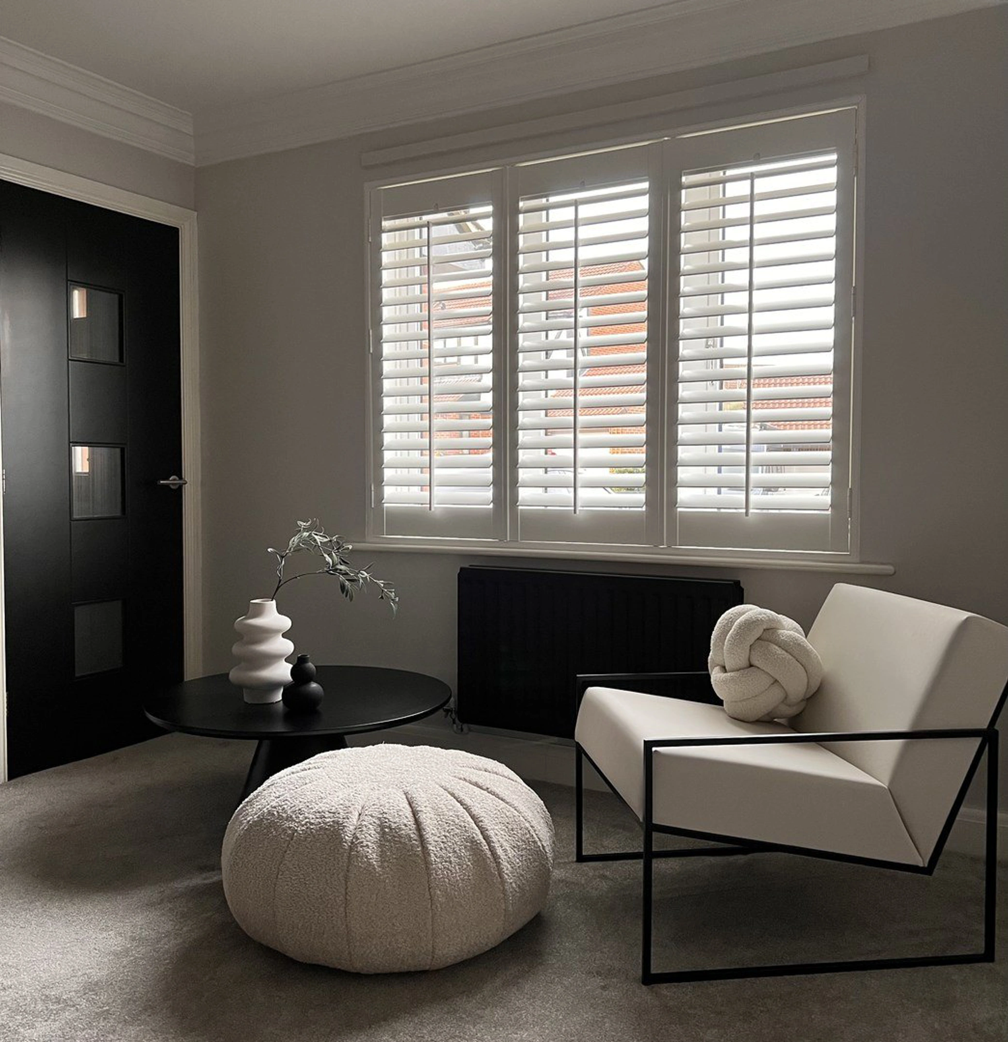 Vivid White faux wood shutters in black and cream modern living room