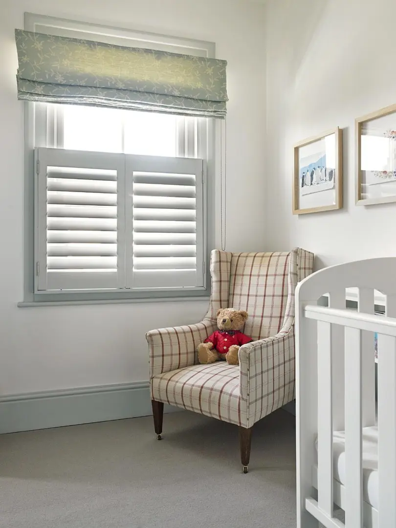 Signal grey wooden window shutters in traditional nursery