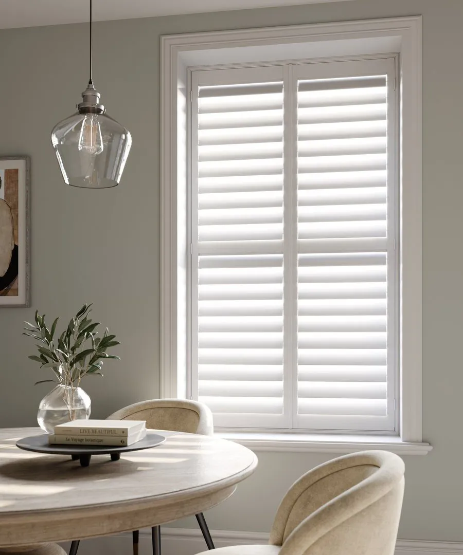 Vivid White full height wooden shutters in dining room