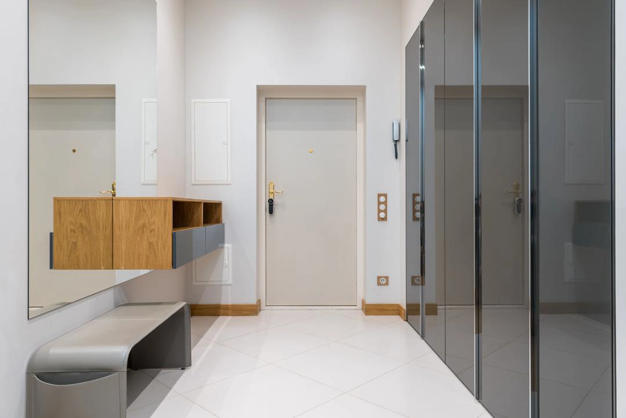 Modern hallway with grey cupboards 