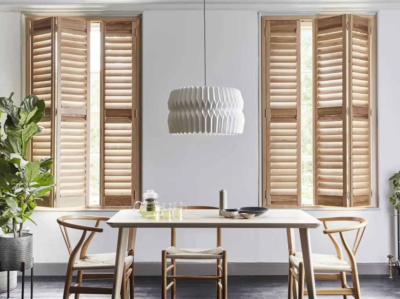 Honey Stained wooden shutters with wood dining table