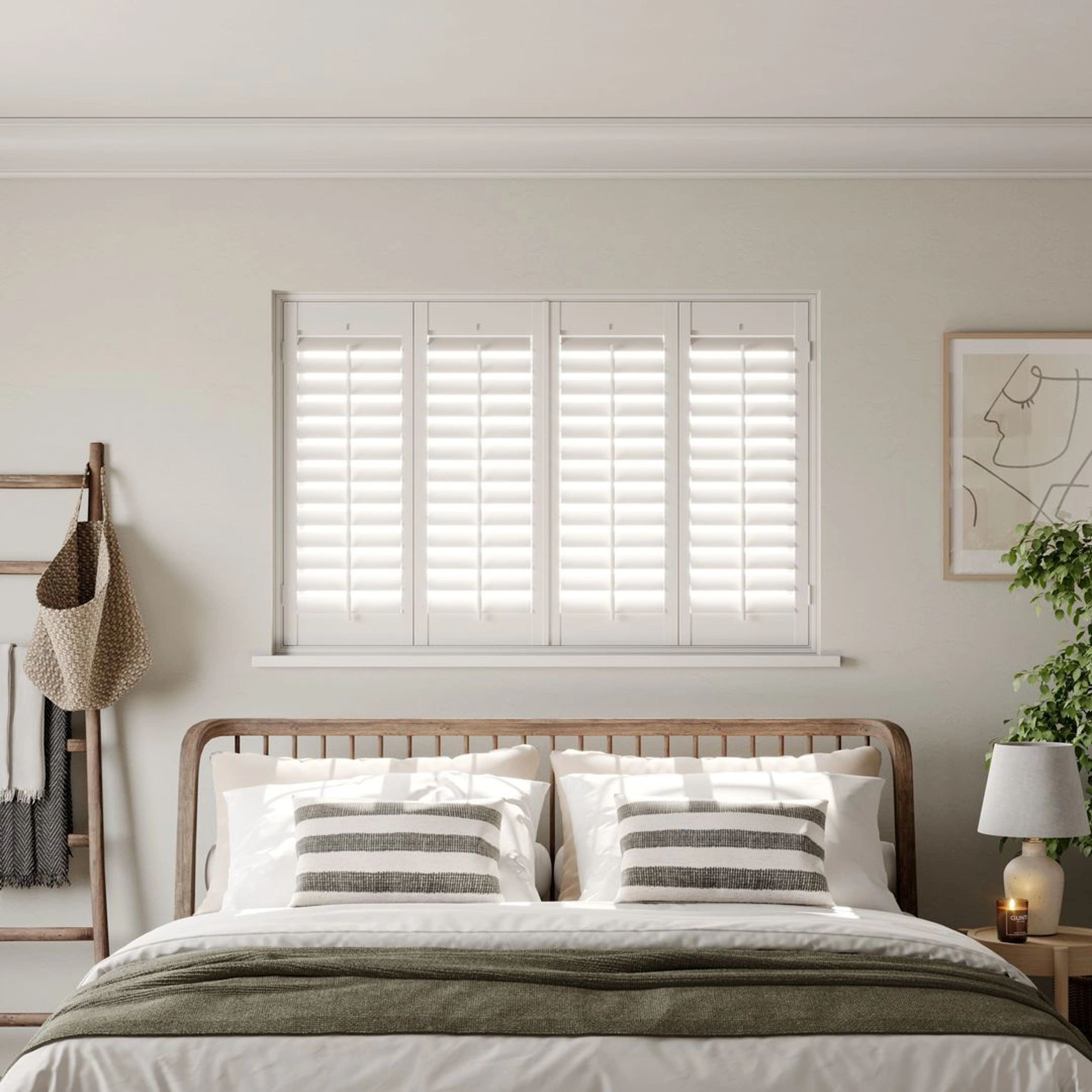 A modern neutral bedroom with Traffic White full height wooden shutters
