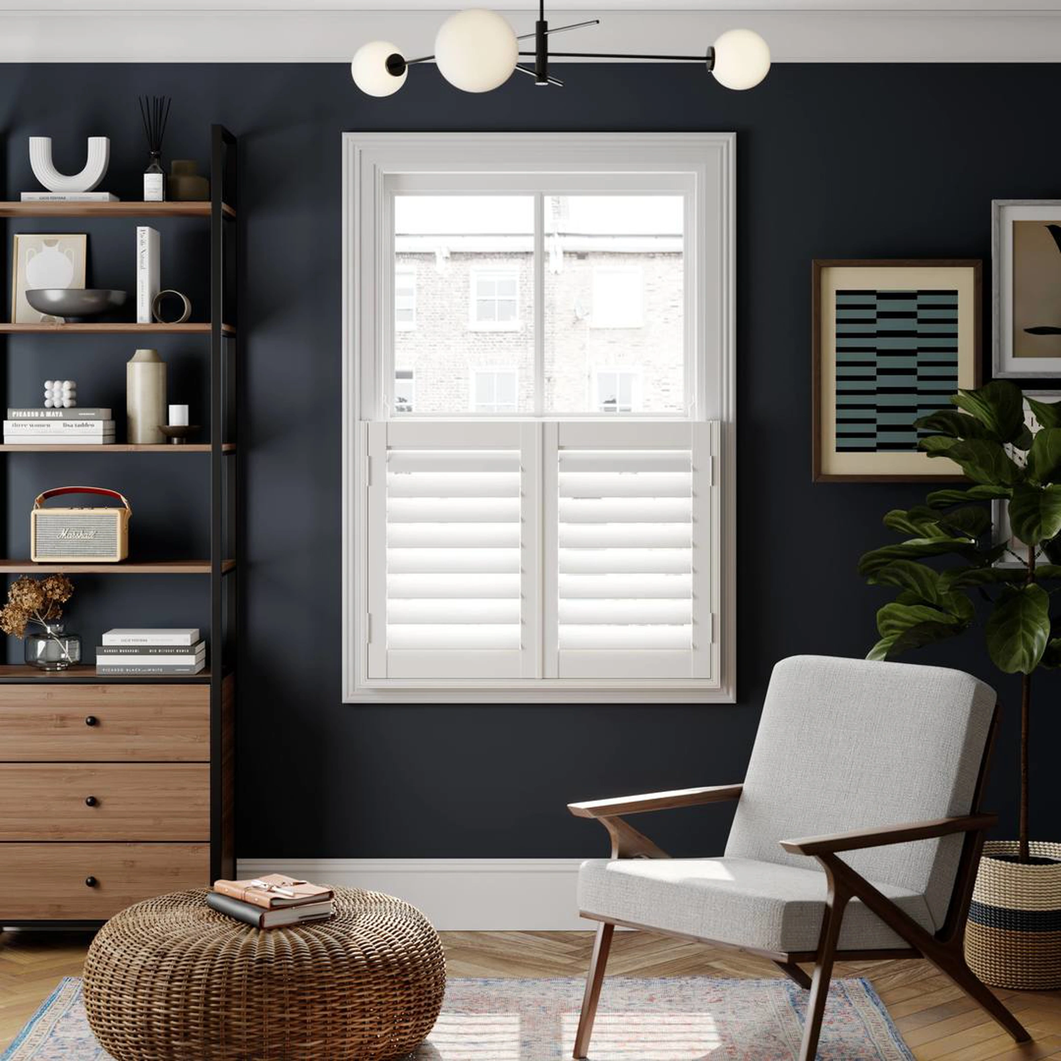 Snow White faux wood shutters on navy wall with wooden shelves and armchair