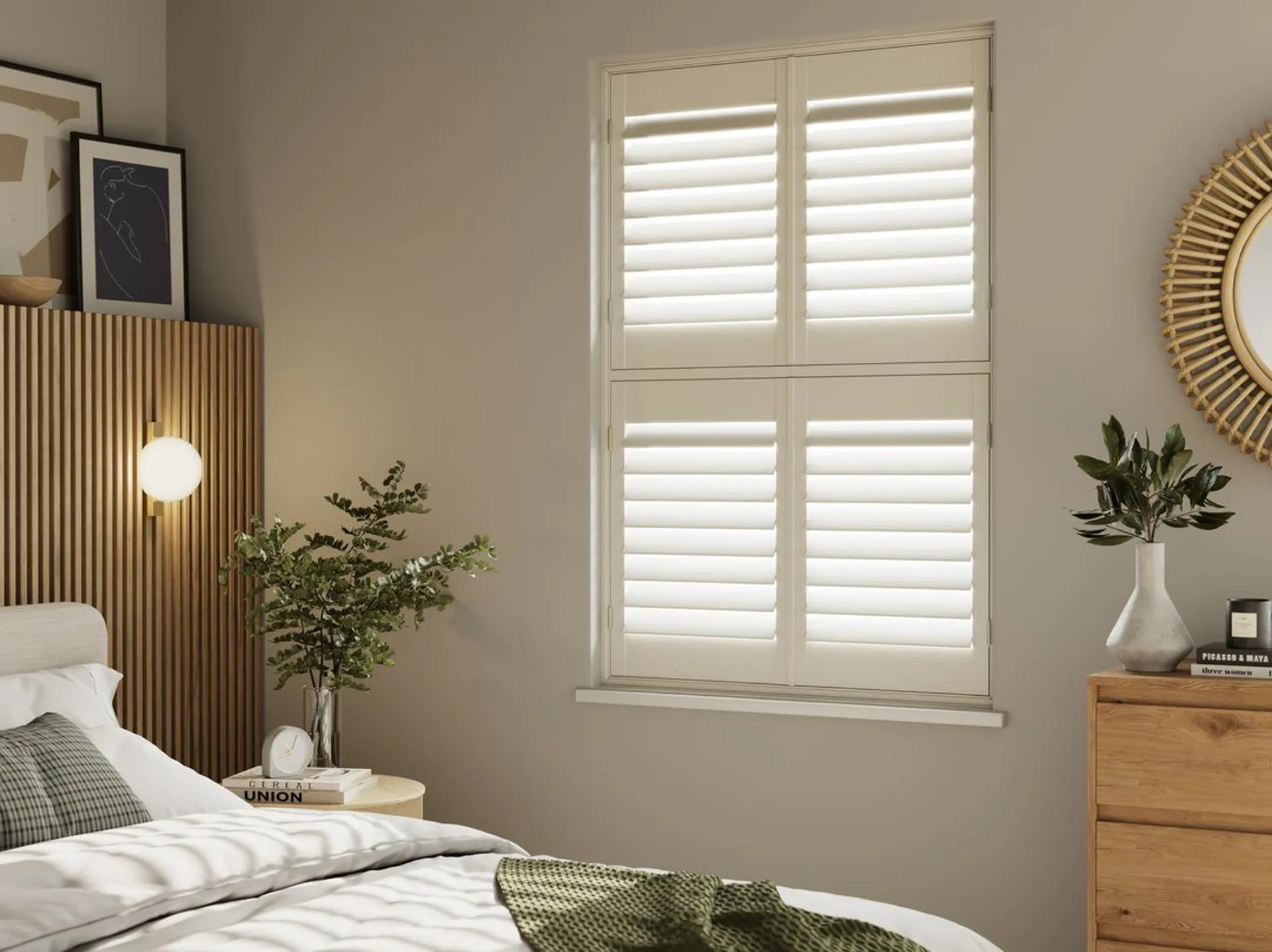 A neutral decorated bedroom with Cream tier on tier wooden shutters