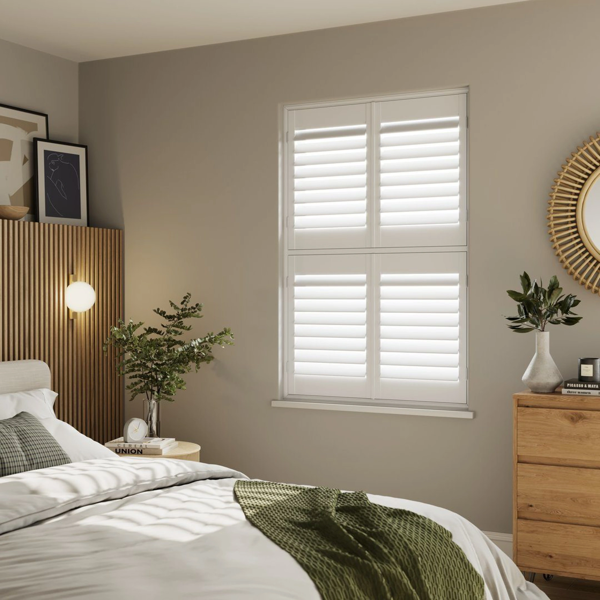 A neutral decorated bedroom with Vivid White tier on tier wooden shutters 
