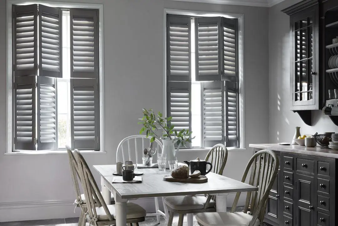 Two Signal Grey tier on tier window shutters in traditional grey kitchen