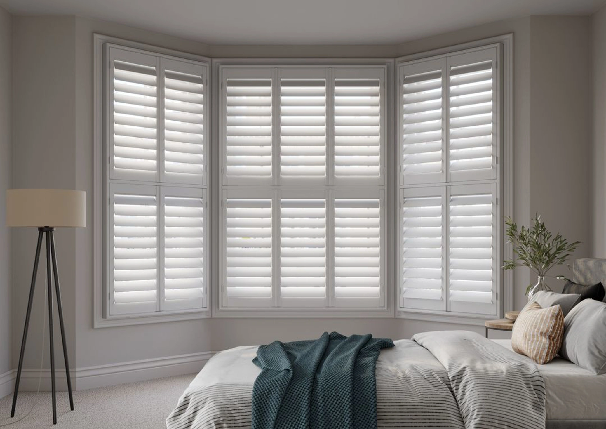 Vivid White angled bay with wooden shutters in a neutral bedroom