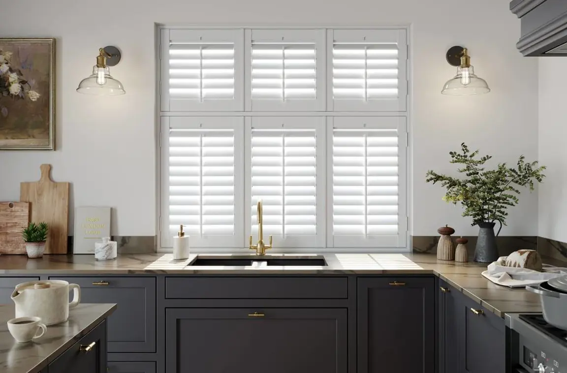 Vivid White faux wood shutters in navy traditional kitchen