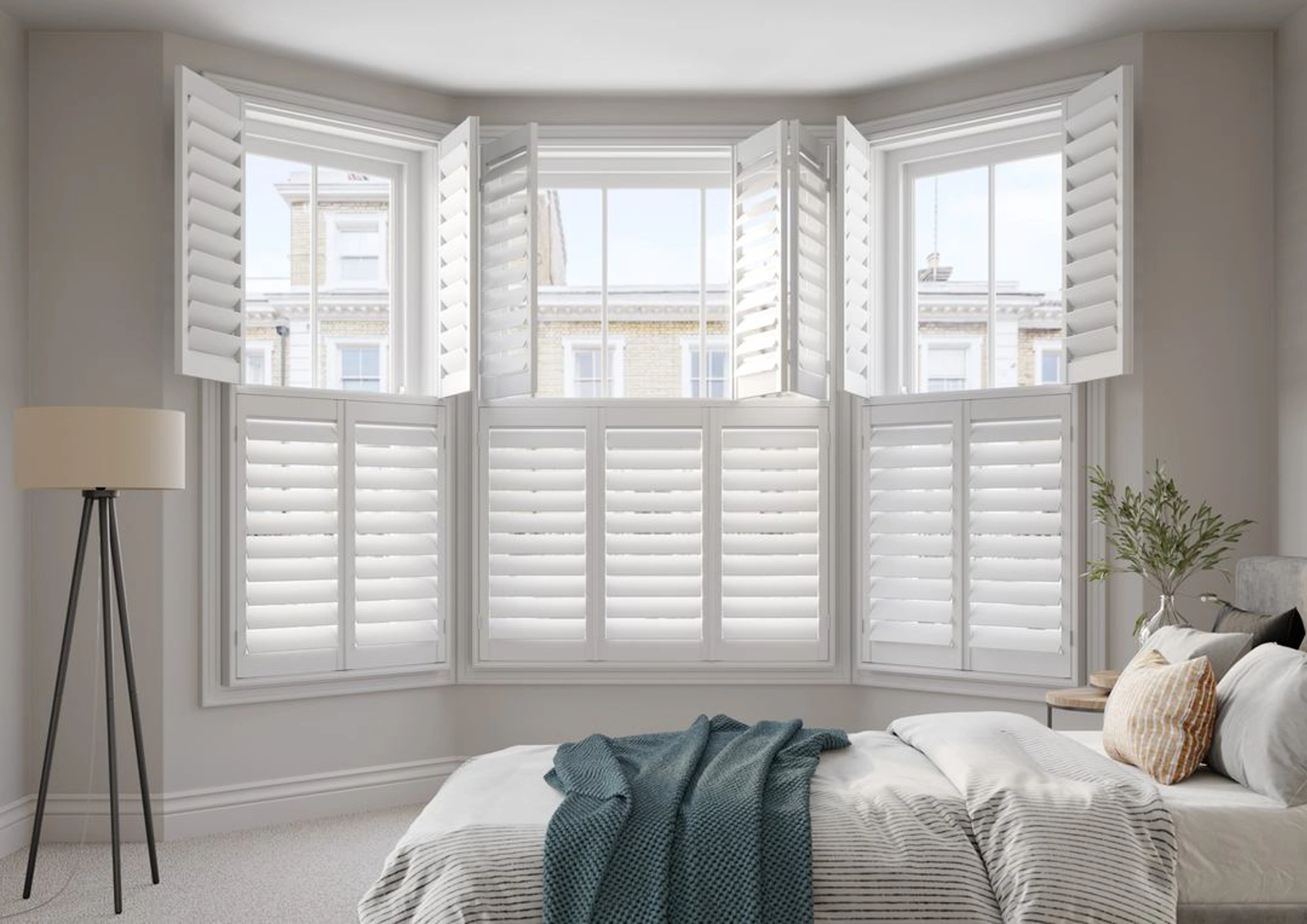 Bay window Vivid White wooden shutters in neutral bedroom
