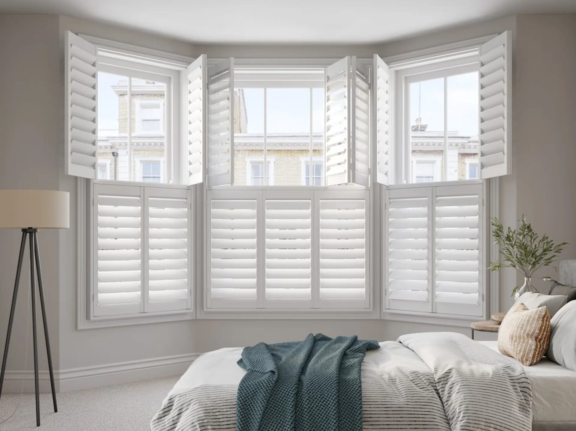 Bay window Vivid White wooden shutters in neutral bedroom