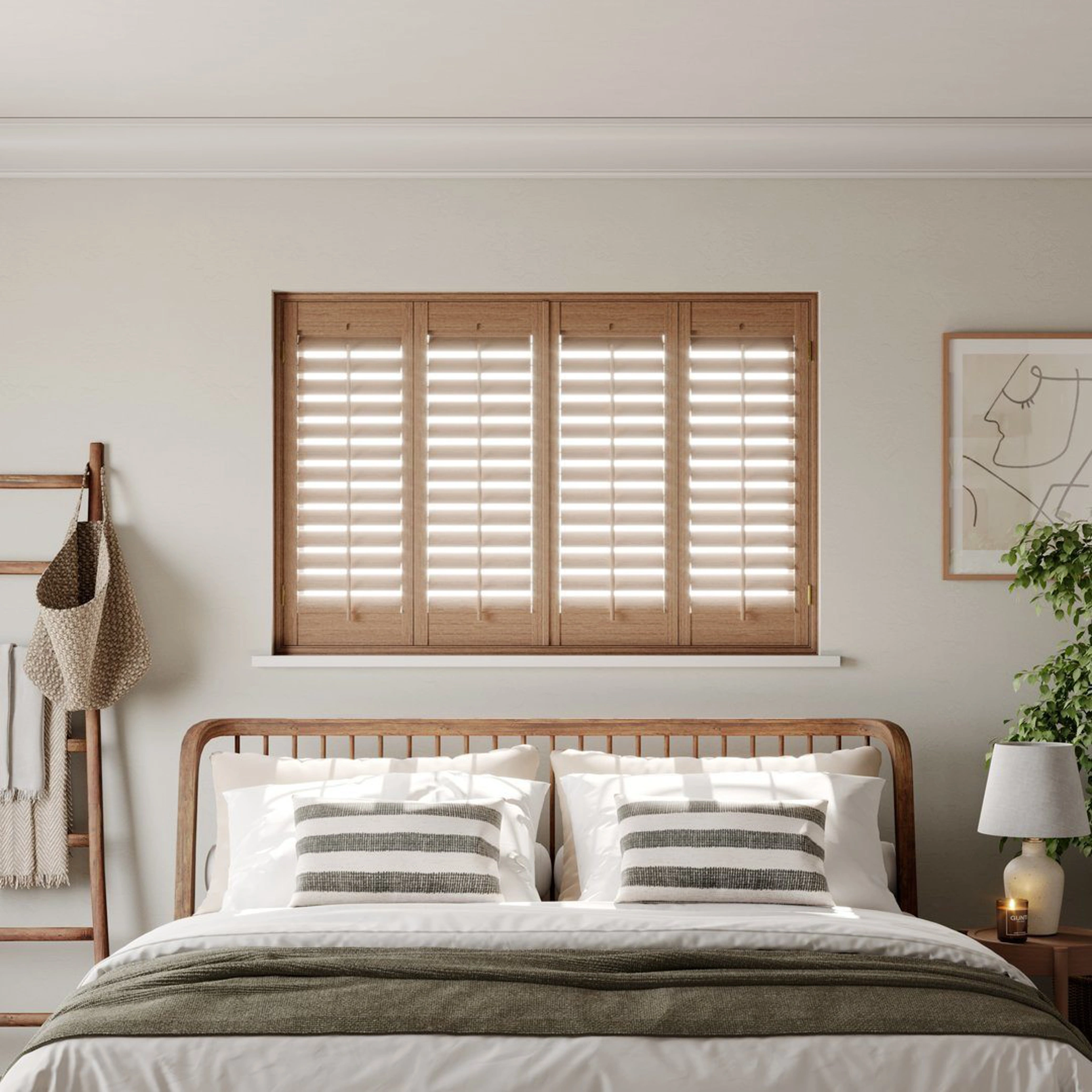 A modern neutral bedroom with Honey Stained full height wooden shutters