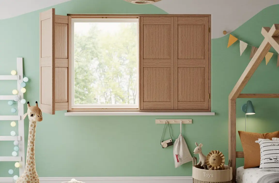 A children's bedroom with Honey Stained solid raised wooden shutters 