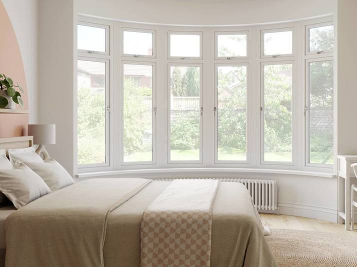Curved bay PVC window in bedroom
